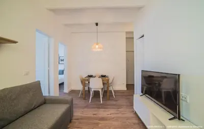 a living room with a couch and a table at Welcomy Poblenou in Barcelona