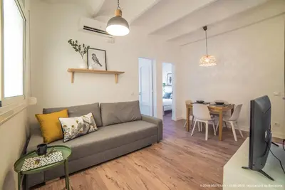 a living room with a couch and a table at Welcomy Poblenou in Barcelona