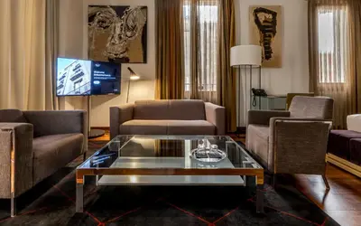 a living room with couches and a tv at Mercer House Bòria BCN in Barcelona