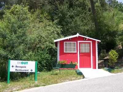 a red tiny house with a sign in front of it at Inout in Barcelona