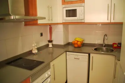 a kitchen with a sink and a counter top at Apartaments Aragó565 in Barcelona