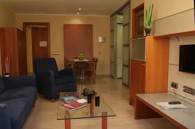 a living room with a couch and a table at Apartaments Aragó565 in Barcelona