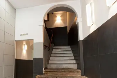 a stairway in a building with a hallway at MH Apartments Liceo in Barcelona