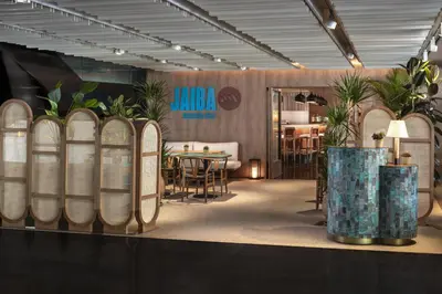 a showroom with a table and chairs in a room at NH Collection Barcelona Constanza in Barcelona