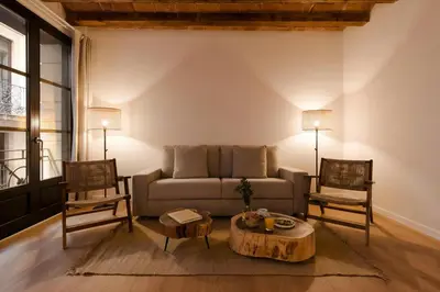 a living room with a couch and two chairs at Hotel Hamsa House in Barcelona