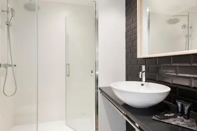 a bathroom with a sink and a shower at Acta BCN 40 in Barcelona
