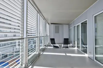 an empty room with windows and chairs in a building at Alcam Llum Deluxe in Barcelona