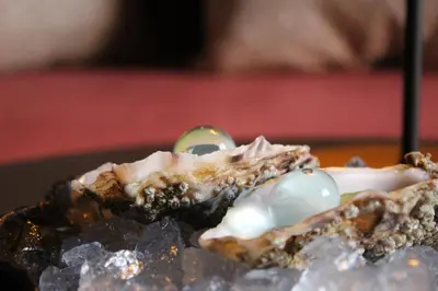 a piece of cake with pearl eggs on top at Hotel Medinaceli 4 Estrellas SUPERIOR in Barcelona