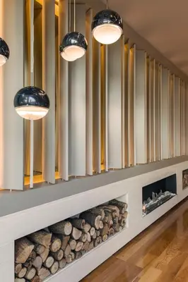 a room with a fireplace with three lights at Hotel Miramar Barcelona GL - Preferred Hotels & Resorts - Newly Renovated in Barcelona