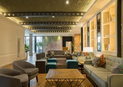 a living room with couches and chairs and a table at ICON Bcn in Barcelona