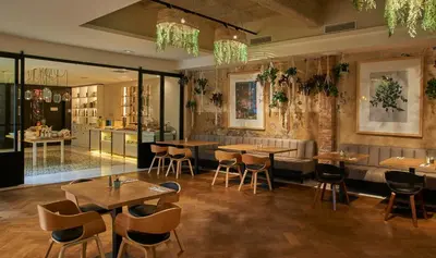 a restaurant with tables and chairs in a room at ICON Bcn in Barcelona