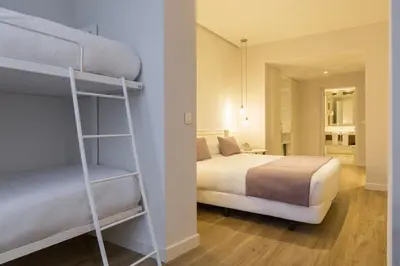 a bedroom with a bed and a bunk bed at ICON Bcn in Barcelona
