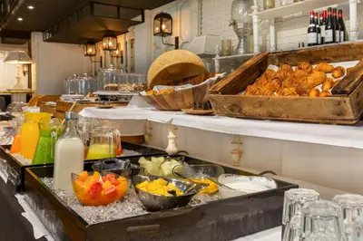 a buffet line with many different foods and drinks at Hotel Market in Barcelona