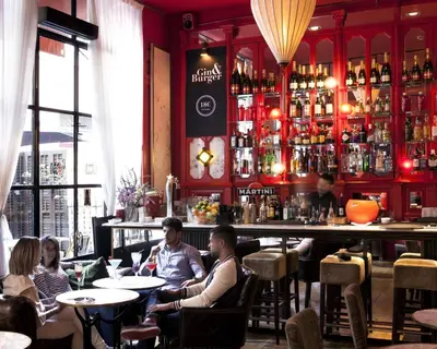 a group of people sitting at a bar at Hotel Market in Barcelona