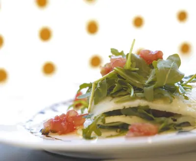 a plate of food with a salad on it at Hesperia Fira in Hospitalet de Llobregat