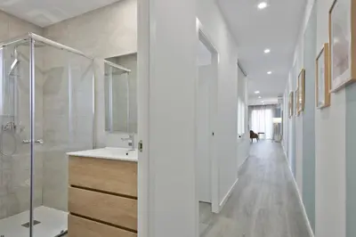 a bathroom with a walk in shower and a sink at Alcam Badalona Roger in Badalona