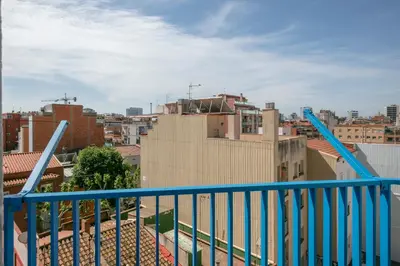 a view of a city from a balcony at Alcam Badalona Roger in Badalona