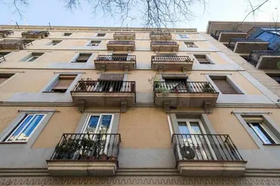 a tall building with balconies on the side of it at Consell Cent apartment I 3 dormitorios Eixample in Barcelona