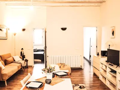 a living room with a couch and a table at MODERN FLAT POBLE NOU in Barcelona