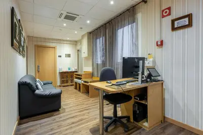 an office with a desk with a computer and a chair at Hotel Lyon in Barcelona