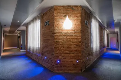 a brick wall with a light on top of it at Petit Palace Museum in Barcelona