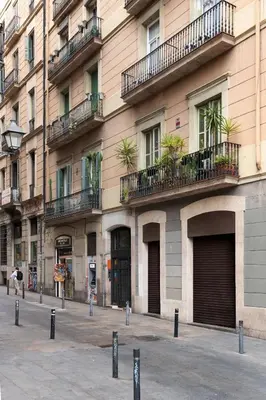 a large building with balconies on the side of it at Chic & Basic Tallers Hostal in Barcelona