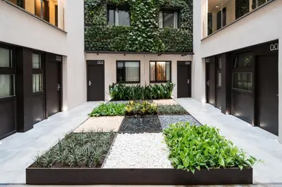 a building with plants in front of it at Catalonia Avinyo in Barcelona