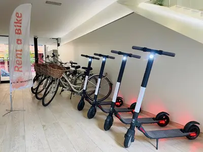 a woman sitting on a couch in a living room at Aparthotel Bcn Montjuic in Barcelona