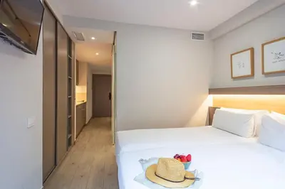 a bathroom with a toilet and a sink at Aparthotel Bcn Montjuic in Barcelona