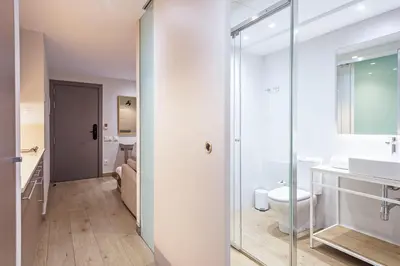 a kitchen with a sink and a counter top at Aparthotel Bcn Montjuic in Barcelona