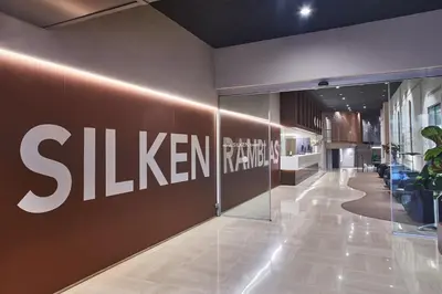 a lobby with a samsung sign on a wall at Silken Ramblas in Barcelona