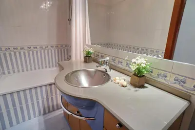 a bathroom with a sink and a bath tub at Barcelona4Seasons - Sagrada Familia in Barcelona