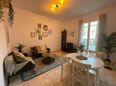 a living room with a table and a couch at Paseo de gracia gran vía de les corts catalanes in Barcelona