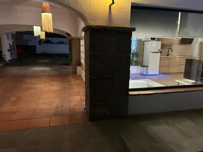 a kitchen with an archway and a counter top at Costa Maresme Barcelona , Relax & Pool in Cabrils