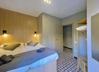 a bedroom with a large bed in a room at Fridays Flats Onix House in Hospitalet de Llobregat