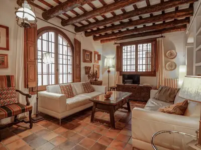 a living room with a couch and a table at Beach Villa Aralinn by Hello Homes Sitges in Sitges