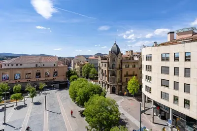 an aerial view of a city with buildings at Espectacular loft en centrico edificio singular in Manresa