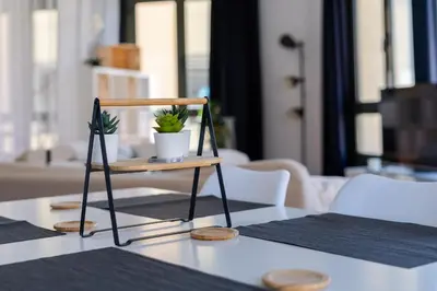 a small stand with two plants on a table at Espectacular loft en centrico edificio singular in Manresa