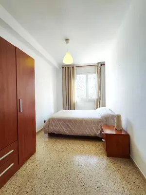 a bedroom with a bed and a window at Apartamento Diagonal Mar, cerca del Forum y Playa in Barcelona
