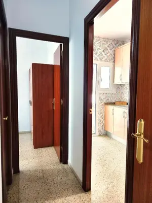 an open door leading to a kitchen with a kitchen at Apartamento Diagonal Mar, cerca del Forum y Playa in Barcelona