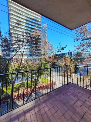 a balcony with a view of a tall building at Apartamento Diagonal Mar, cerca del Forum y Playa in Barcelona