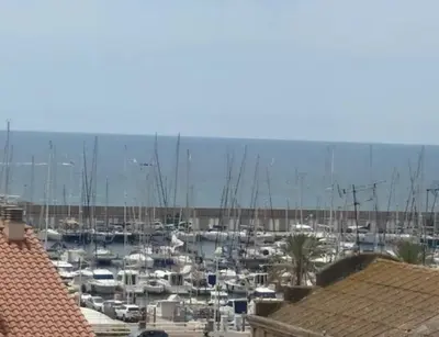 a group of boats docked in a harbor at CAM Maresme 1 apartamento Barcelona y playa in Masnou