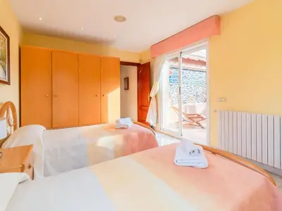 a hotel room with two beds and a window at Holiday Home Aurea by Interhome in Pineda de Mar