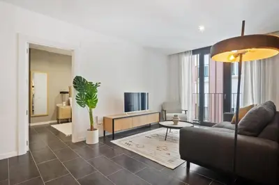 a living room with a couch and a table at CATERINA 22@ POBLENOU in Barcelona
