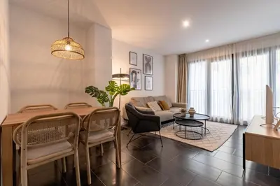 a living room with a table and a couch at CATERINA 22@ POBLENOU in Barcelona