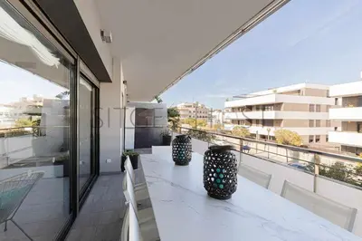 a balcony with two vases sitting on top of a building at Sitges PORT - Con piscina, a 5 minutos de la playa in Sitges
