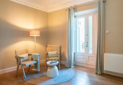 a room with a table and a chair and a door at Hotel Font de la Canya in Avinyonet