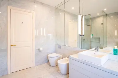 a bathroom with a sink and a toilet and a mirror at Hotel Font de la Canya in Avinyonet