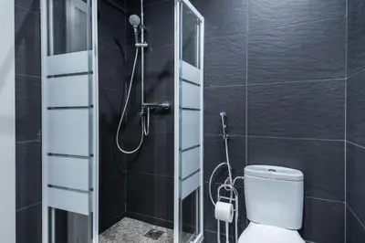 a bathroom with a shower with a toilet in it at Apartment Next to Sagrada Familia, the Essence of Barcelona in Barcelona