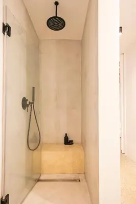 a shower in the corner of a room at Penthouse with Rooftop apartment in the Barceloneta - Barcelona in Barcelona